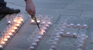 Candles lit in Nalchik in memory of the Caucasian War victims. Screenshot of the video by the "Caucasian Knot" https://www.youtube.com/watch?v=4z5rMPPC5YY