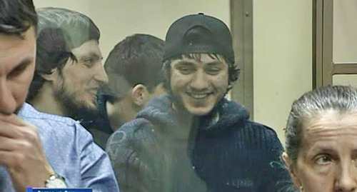 Lechi Gadamauiri (in the center) durung the trial. Screenshot of the video https://www.youtube.com/watch?v=tiCR14m_A70