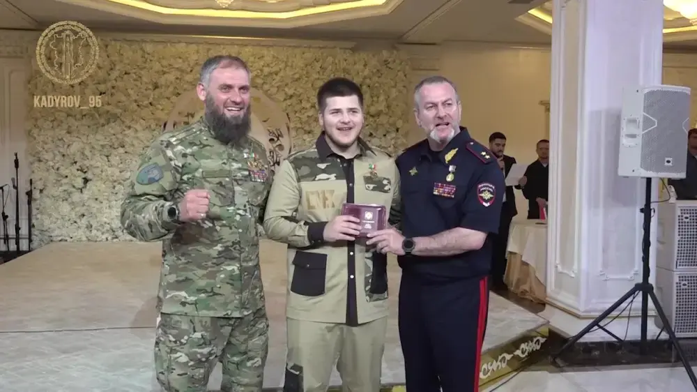 Adam Kadyrov (center) receiving the "Defender of Chechnya" medal. Screenshot of the video Telegram channel Kadyrov_95