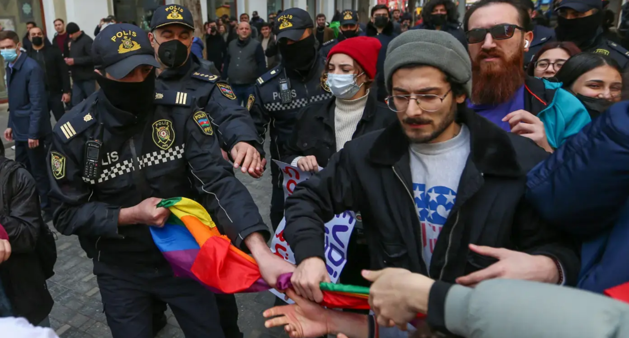 Police officers confiscate an LGBT flag from a protester. Baku, March 2022. Photo by Aziz Karimov for the "Caucasian Knot"