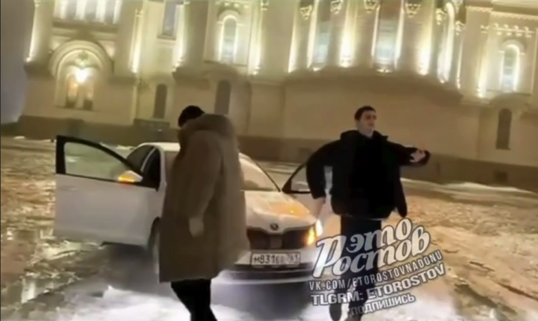 A still of three young people dancing near the cathedral. Photo: Donnews / Telegram channel