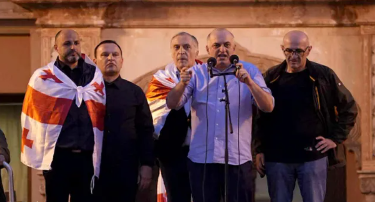 From left to right: Irakli Nadiradze, Paata Manzhgaladze, Paata Burchuladze, Murtaz Zodelava, Lasha Beridze at the rally 04.10.25. Screenshot of photo "Interpressnews" https://www.interpressnews.ge/ru/article/174819-po-delu-4-oktiabria-paata-burchuladze-murtaz-zodelava-iraklii-nadiradze-lasha-beridze-i-paata-ma ndzhgaladze-prigovoreny-k-7-tornike-mchedlishvili-nika-gventsadze-iraklii-chkhvirkiia-k-5-a-iraklii-shaishmelashvili-k-2-godam-lisheniia-svobody.